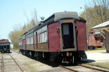Vintage railway passenger car parked on tracks