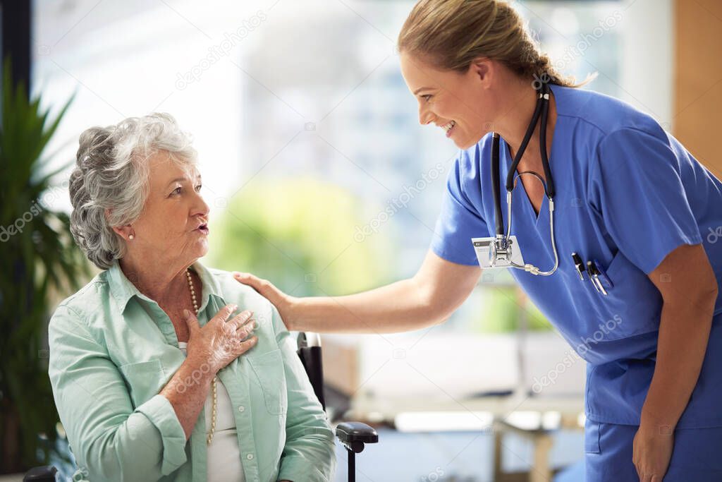 Shot of a carer at a nursing home with her patient