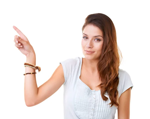 Right over there. Portrait of a gorgeous young woman pointing at copyspace. Royalty Free Stock Photos
