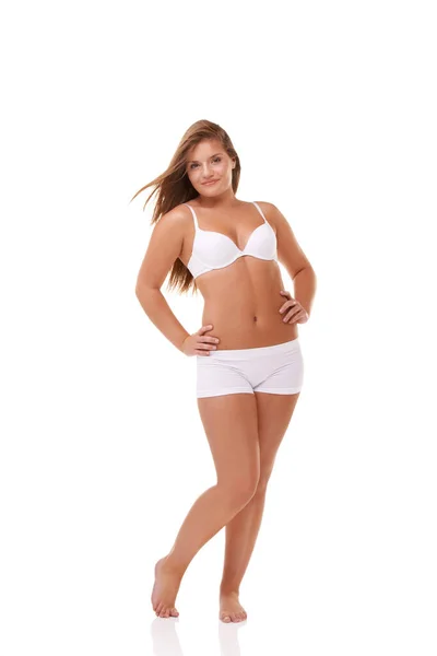 Her confidence is all natural. A group of women with different body shapes  standing together in their underwear while isolated on white. Stock Photo  by ©PeopleImages.com 542970112