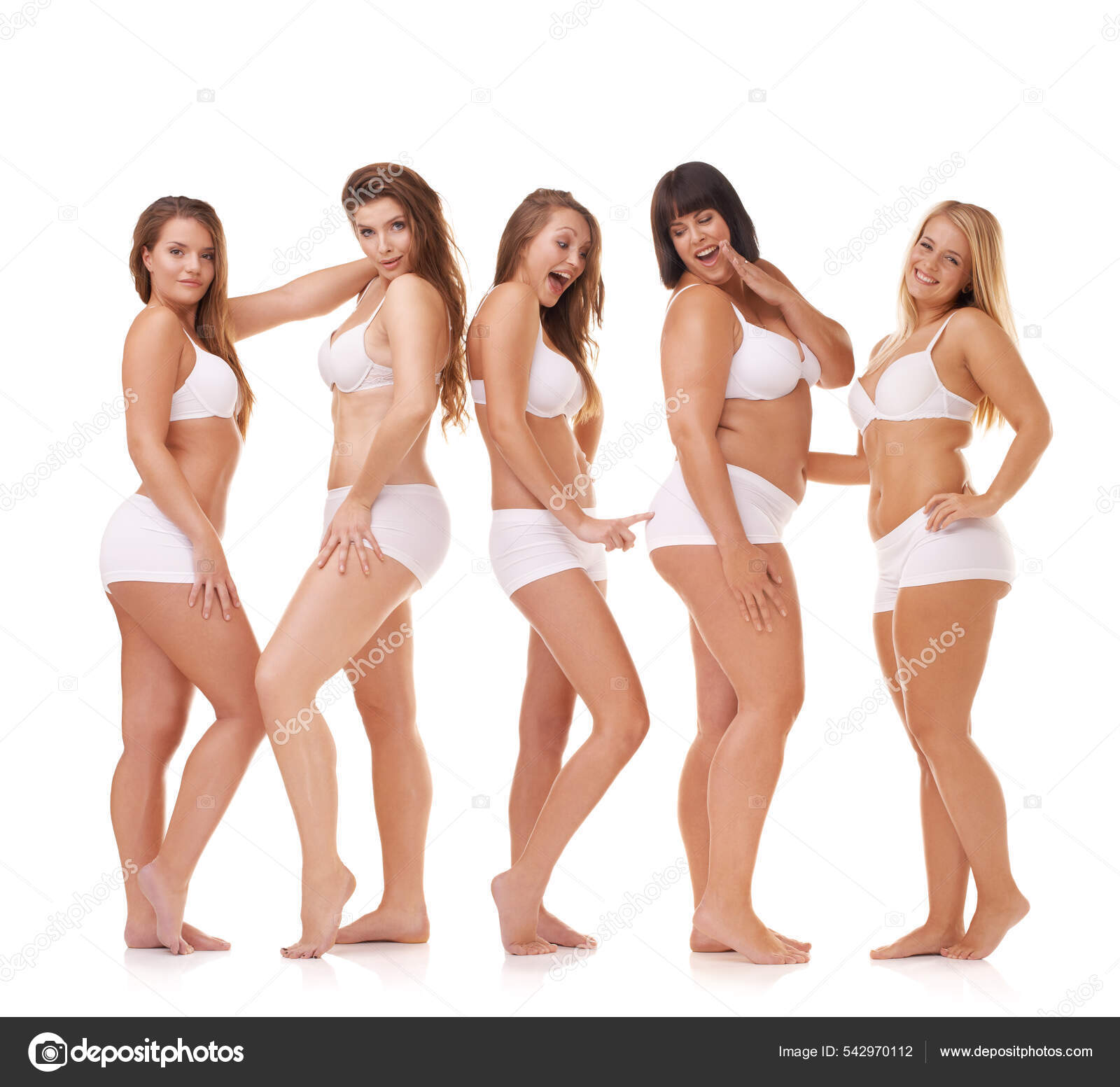 Her confidence is all natural. A group of women with different body shapes  standing together in their underwear while isolated on white. Stock Photo  by ©PeopleImages.com 542970112