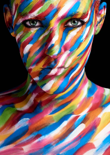 My face is a canvas. Cropped portrait of a young woman posing with paint on her face. — Stock Photo, Image