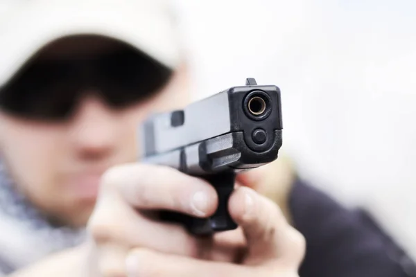 Training is hand eye coordination. Closeup selective focus of a handgun held by a soldier during a training. — Stock Photo, Image