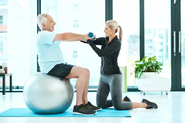 Dumbbells Physiotherapy Exercise Doctor Old Man Rehabilitation Training  Balance Health Stock Photo by ©PeopleImages.com 657657206