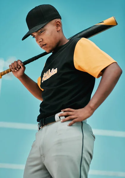 Ill have better luck next time. Shot of a young baseball player holding a baseball bat while posing outside on the pitch. — Stock Photo, Image