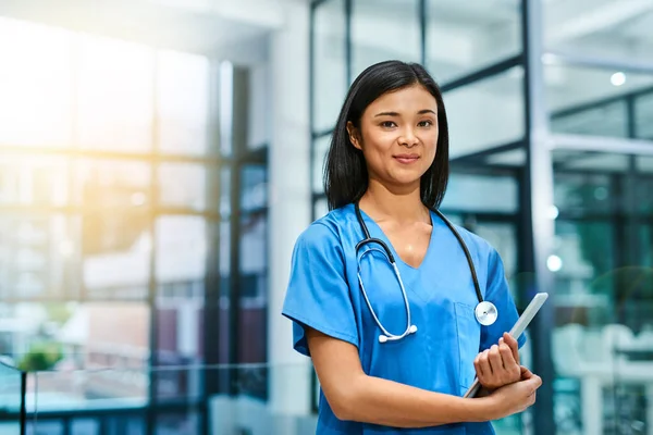 Your health is fundamental to me. Portrait of a young nurse standing in a hospital. — Stock Photo, Image