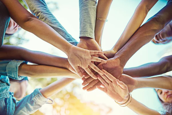 Life is amazing when you have the greatest friends around. Cropped shot of a group of friends with their hands piled on top of each other. — Stock Photo, Image