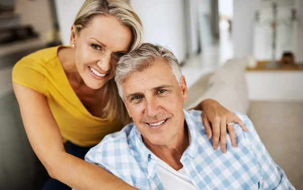 The only secret to a long marriage is love. Cropped shot of a loving mature couple relaxing at home. — Stock Photo, Image