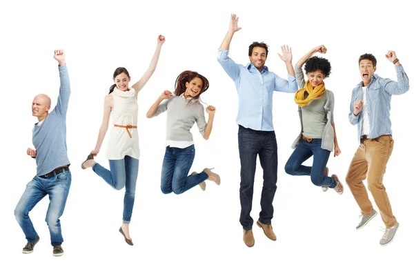 Celebrations in isolation. Full body shot of a group of excited people jumping into the air. Royalty Free Stock Photos