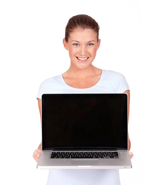 Wat dit is een blik op de wereld. Een mooie jonge vrouw presenteren een top van de lijn laptop aan u - geïsoleerd. — Stockfoto