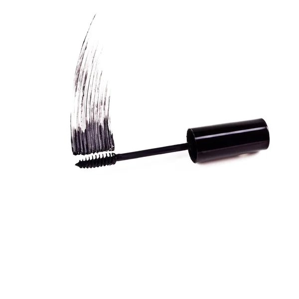 The drama of mascara. Studio shot of a mascara brush smearing makeup against a white background. — Stock Photo, Image