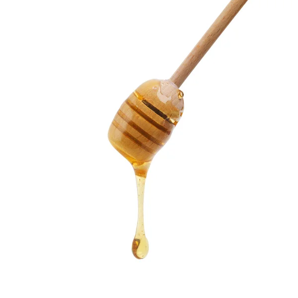 Dripping with bee juice. Shot of a honey dipper dripping delicious honey. — Stock Photo, Image