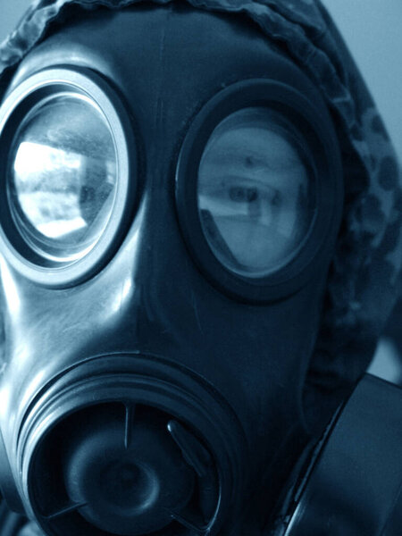 Sound the sirens. Closeup shot of a man in a gasmask.