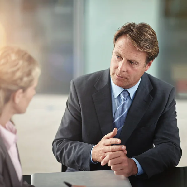 Just a couple of points.... Cropped shot of two businesspeople in a meeting. Stock Photo