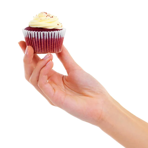 Frostige Güte. Nahaufnahme Studio-Aufnahme einer Frau, die einen Cupcake isoliert auf Weiß hochhält. — Stockfoto