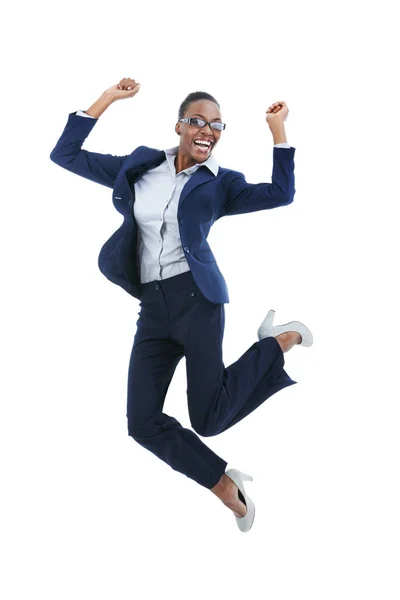 Overjoyed with her success. Full length studio shot of an excited young businesswoman jumping in the air isolated on white. — Stock Photo, Image