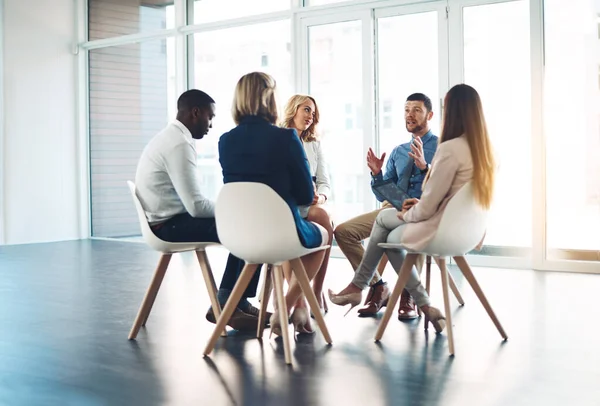 Putting their minds to work. Full length shot of a group of corporate colleagues meeting in their office. — Stock Photo, Image