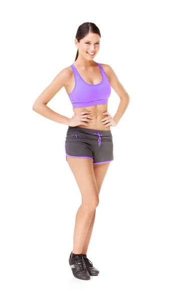 Looking like this takes a lot of work. Full length portrait of a fit young woman in gym clothing isolated on white. — Stock Photo, Image
