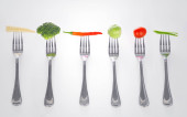 Картина, постер, плакат, фотообои "mouthful of goodness. a series of forks with healthy mouthfuls of vegetables on them.", артикул 549846824