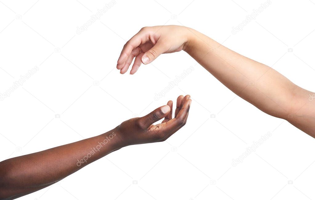Theres so much power in helping each other. Cropped studio shot of two women reaching their hands out to each other against a white background.