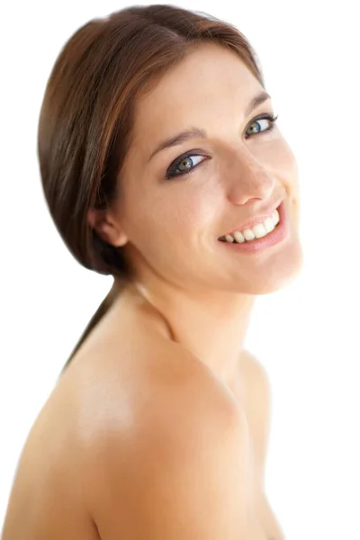 Her smile brings a sparkle to her eyes. Portrait of a beautiful young brunette on a white background. — Stock Photo, Image