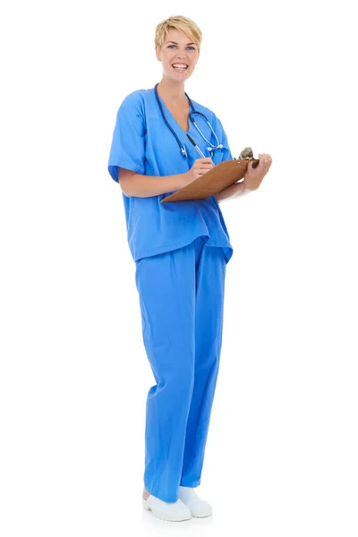 Keeping track of her daily schedule. A young female doctor holding a clipboard against a white background. — Stock Photo, Image