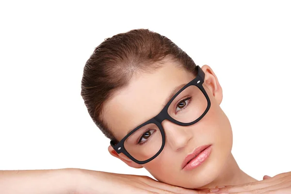 Authoritative Beauty. Studio shot of a beautiful woman wearing thick rimmed glasses isolated on white. Stock Image