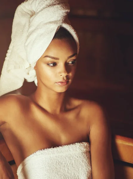 Surrendering to serenity. Cropped shot of a young woman relaxing in the sauna at a spa. — Stock Photo, Image