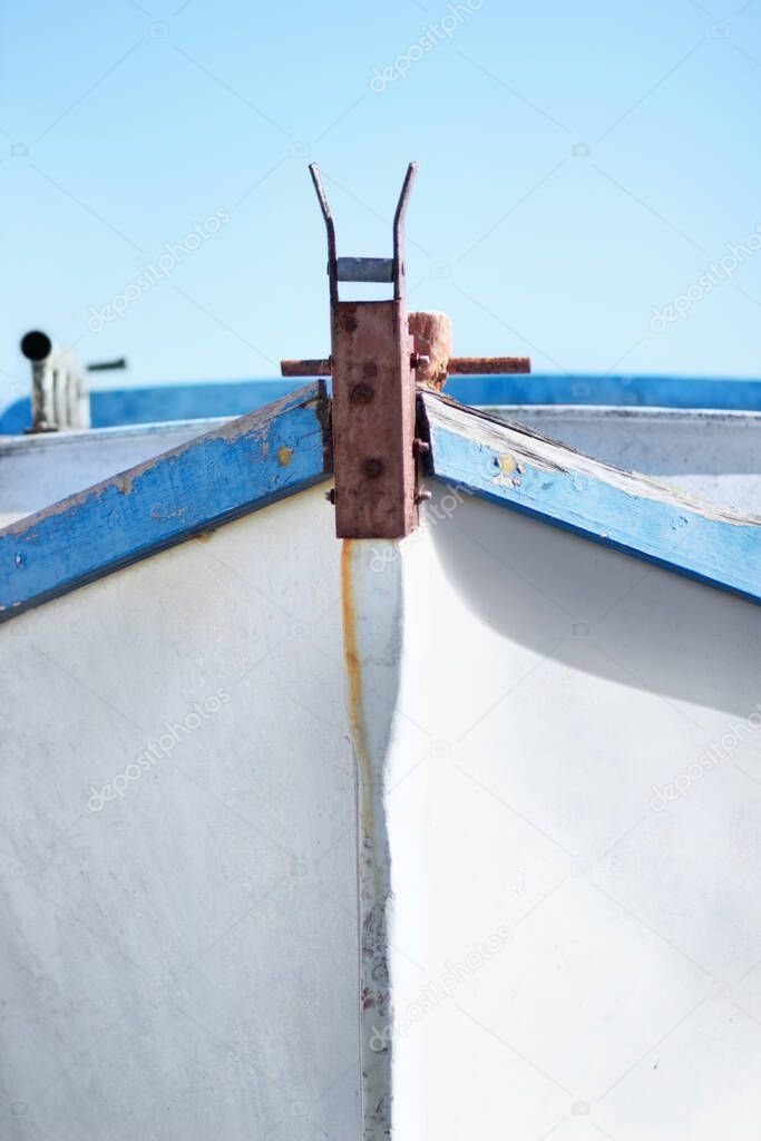 Take the bow. Front of a small fishing boat with nobody inside it.