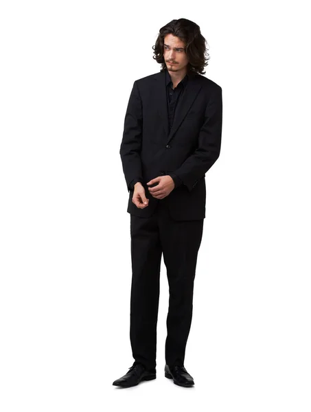 Ha stile e fascino. Bello giovane in posa in un abito nero - tutta la lunghezza. — Foto Stock
