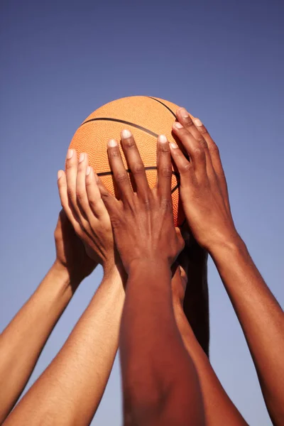 Man united. Closeup of hands holding up a basketball. — Stock Photo, Image