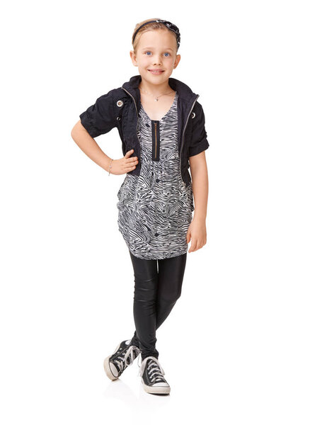 Shes a stylish young girl - Child fashion. A young girl posing in the studio.