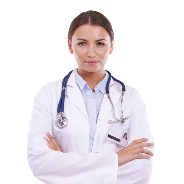 Jouw gezondheid is haar geluk. Portret van een prachtige arts met armen gekruist tegen een witte achtergrond. — Stockfoto