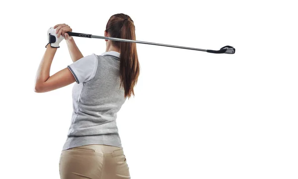 Perfecting her follow through. Studio shot of a young golfer practicing her swing isolated on white. — Stock Photo, Image