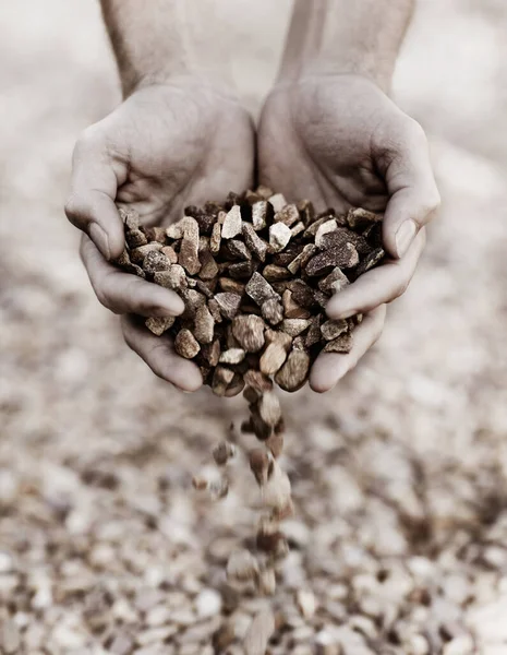 Letting the stones fall. Closeup of two hands holding gravel. — Stock Photo, Image