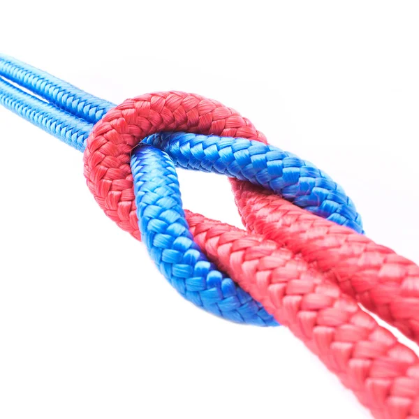 Tied together. Studio shot ropes knotted together isolated on white. — Stock Photo, Image