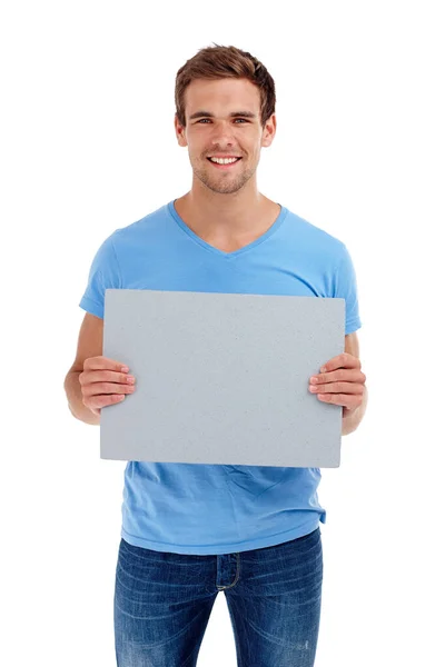 Su mensaje aquí. Estudio de un joven sosteniendo una tabla gris. — Foto de Stock