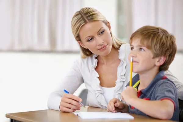 Enriching eager young minds. A young teacher in her classroom. — Stock Photo, Image