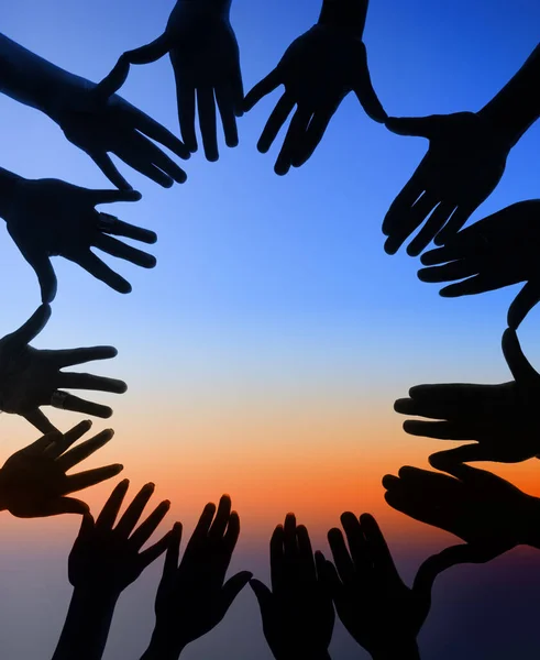 United around every horizon. Shot of a group of hands spread out together in a circle. — Stock Photo, Image
