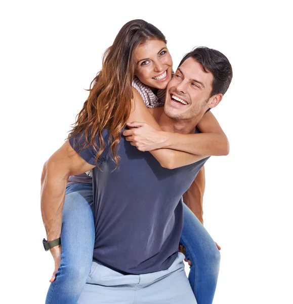 Huckepack-Liebe. Studioaufnahme eines jungen Mannes, der seiner Freundin ein Huckepack gibt, isoliert auf Weiß. — Stockfoto