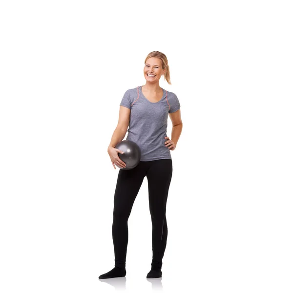 Wow This ball made all the difference. A pretty young blonde holding an exercise ball after an invigorating workout. — Stock Photo, Image