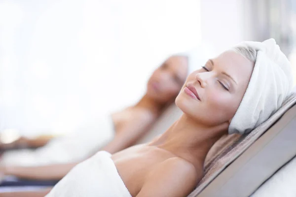 Theres nothing better than a day at the spa. A beautiful young woman relaxing at the beauty spa.