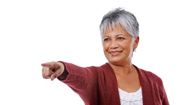 Volwassen levensstijl. Studio shot van een volwassen vrouw wijzen geïsoleerd op wit. — Stockfoto