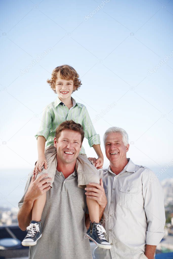 Ill raise him right. Cropped portrait of a young boy with his father and grandfather.