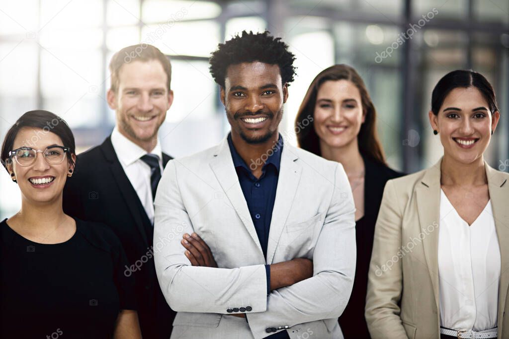 Weve got you covered. Cropped portrait of a group of businesspeople standing in the office.