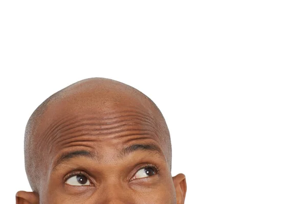 Revisando tu copia. Una imagen recortada de un hombre afroamericano mirando hacia arriba en el copyspace. —  Fotos de Stock