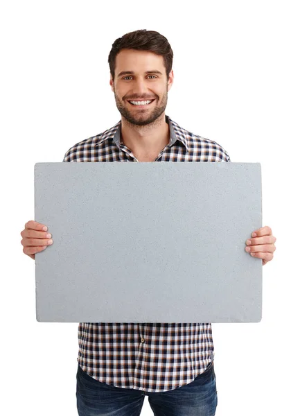 Esto es perfecto. Retrato del estudio de un joven guapo sosteniendo un cartel en blanco aislado en blanco. — Foto de Stock