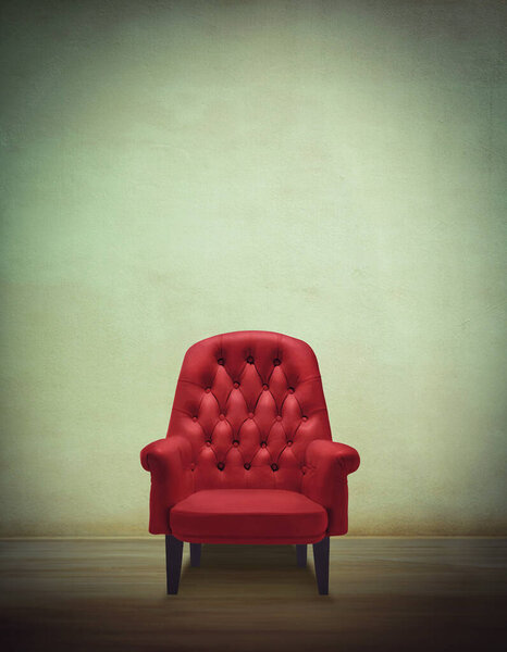 The seat of solitude. Shot of a red chair in an otherwse empty room.