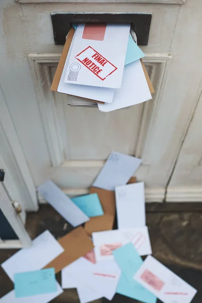 Crammed with correspondence. Cropped shot of letters in a letter box. — Stock Photo, Image