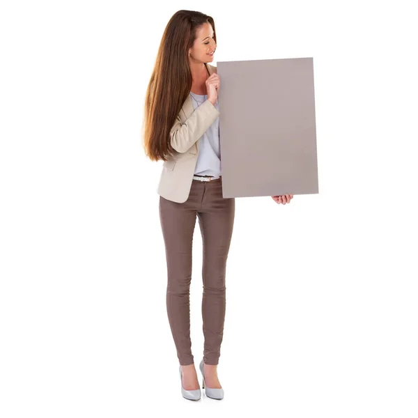 Lets get you noticed. Studio shot of a young businesswoman holding a blank field of tan copyspace. — Stock Photo, Image